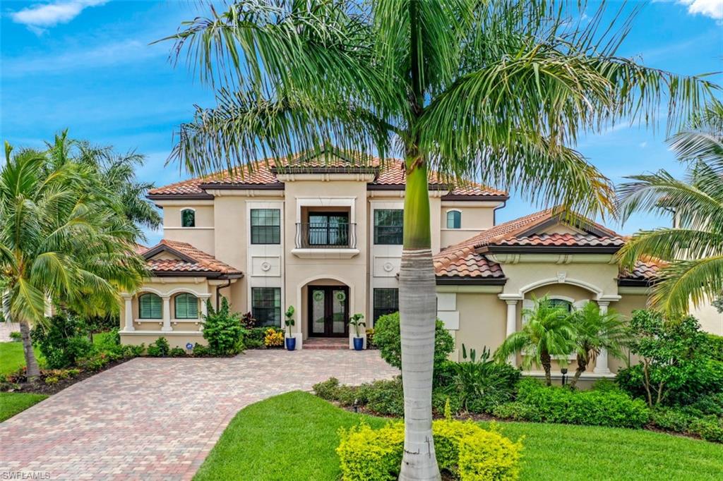 a house with palm tree in front of it