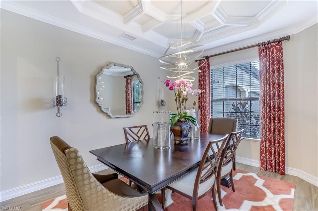 3289 Runaway Lane Naples, FL 34114 - Photo 16 of 35 a view of a dining room with furniture and wooden floor
