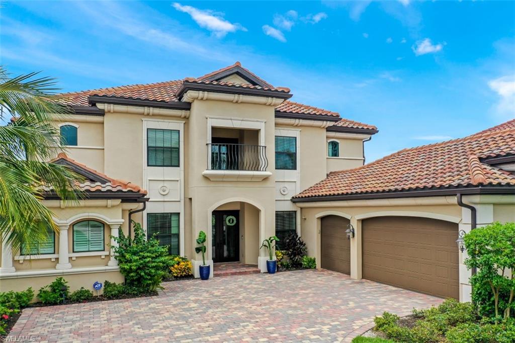 3289 Runaway Lane Naples, FL 34114 - Photo 2 of 35 a front view of a house with a yard