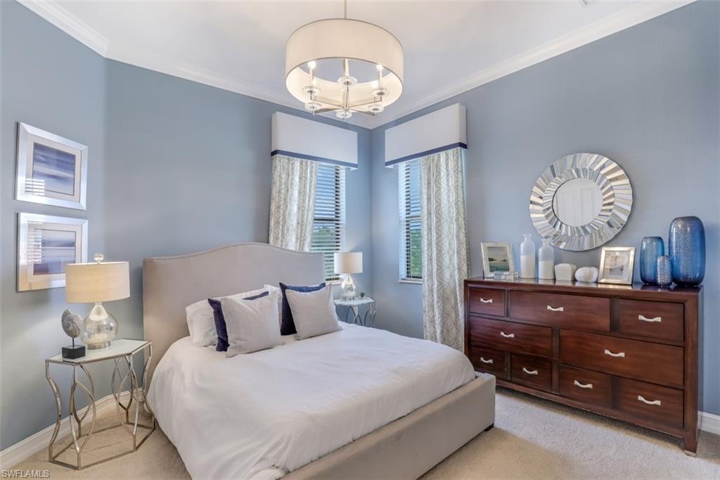 3289 Runaway Lane Naples, FL 34114 - Photo 21 of 35 a bedroom with a bed and wooden floor