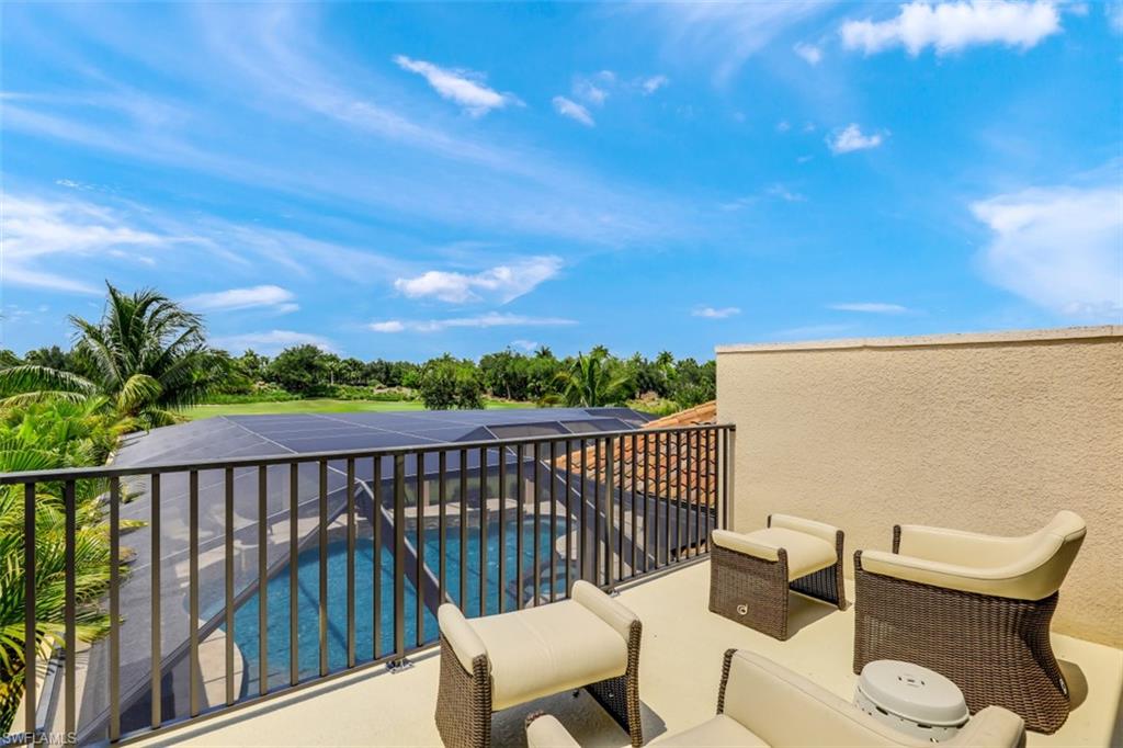 3289 Runaway Lane Naples, FL 34114 - Photo 27 of 35 a view of a chair and tables in the balcony