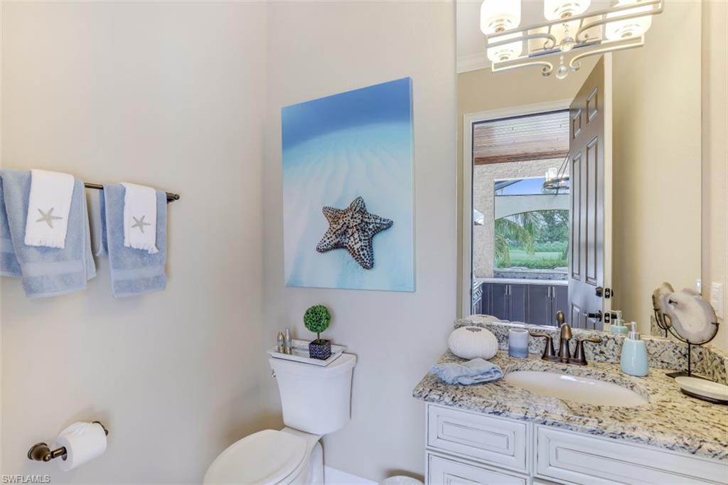 3289 Runaway Lane Naples, FL 34114 - Photo 28 of 35 a bathroom with a granite countertop sink a toilet and with mirror