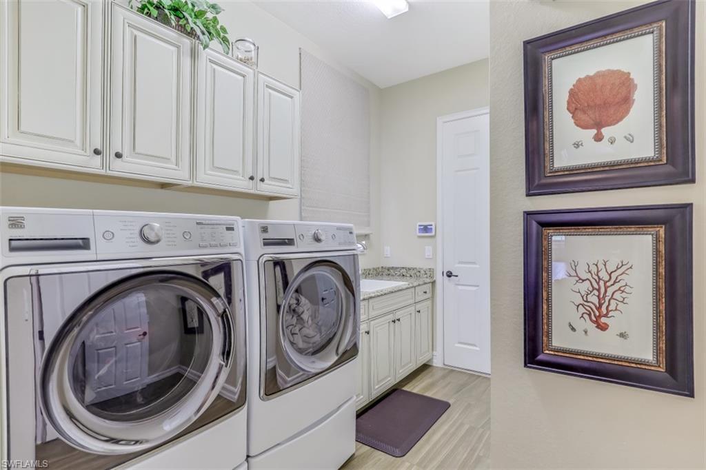 3289 Runaway Lane Naples, FL 34114 - Photo 29 of 35 a utility room with dryer and washer