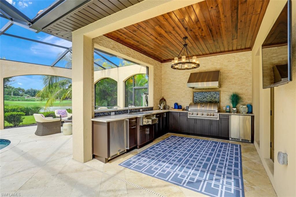 3289 Runaway Lane Naples, FL 34114 - Photo 30 of 35 a kitchen with a stove a sink and a refrigerator