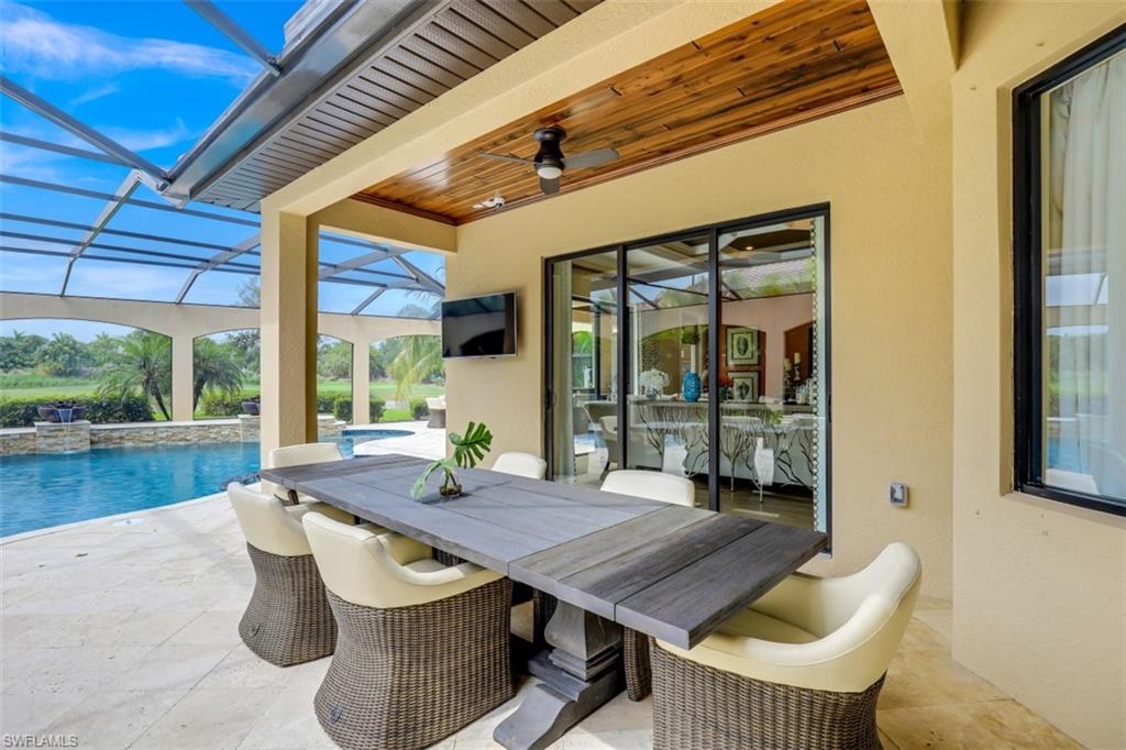 3289 Runaway Lane Naples, FL 34114 - Photo 31 of 35 a outdoor dining space with furniture