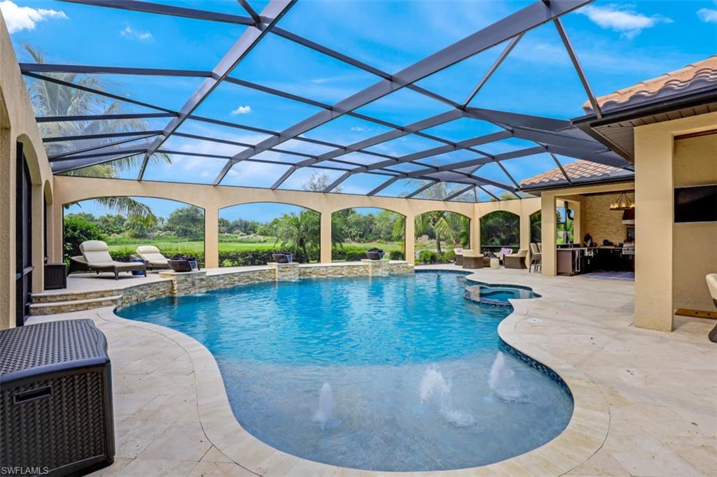 3289 Runaway Lane Naples, FL 34114 - Photo 33 of 35 a view of a swimming pool with a patio