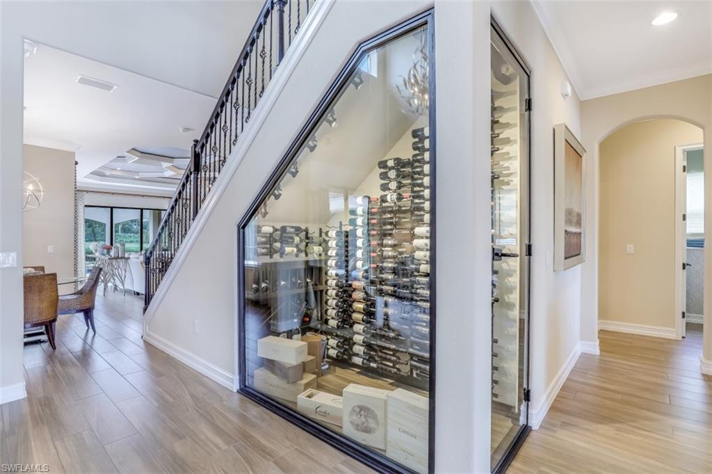 3289 Runaway Lane Naples, FL 34114 - Photo 6 of 35 a view of entryway and hall with wooden floor
