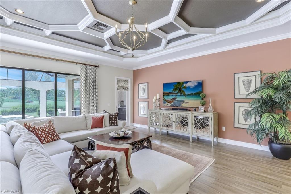 3289 Runaway Lane Naples, FL 34114 - Photo 9 of 35 a living room with furniture and a flat screen tv