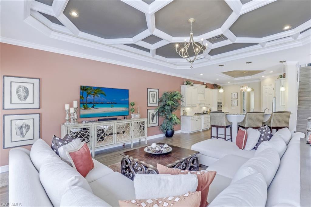 3289 Runaway Lane Naples, FL 34114 - Photo 10 of 35 a living room with furniture and a flat screen tv