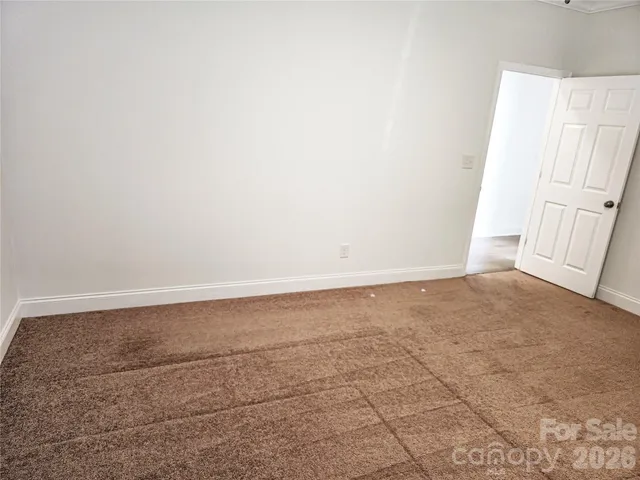 a view of storage and utility room with a window