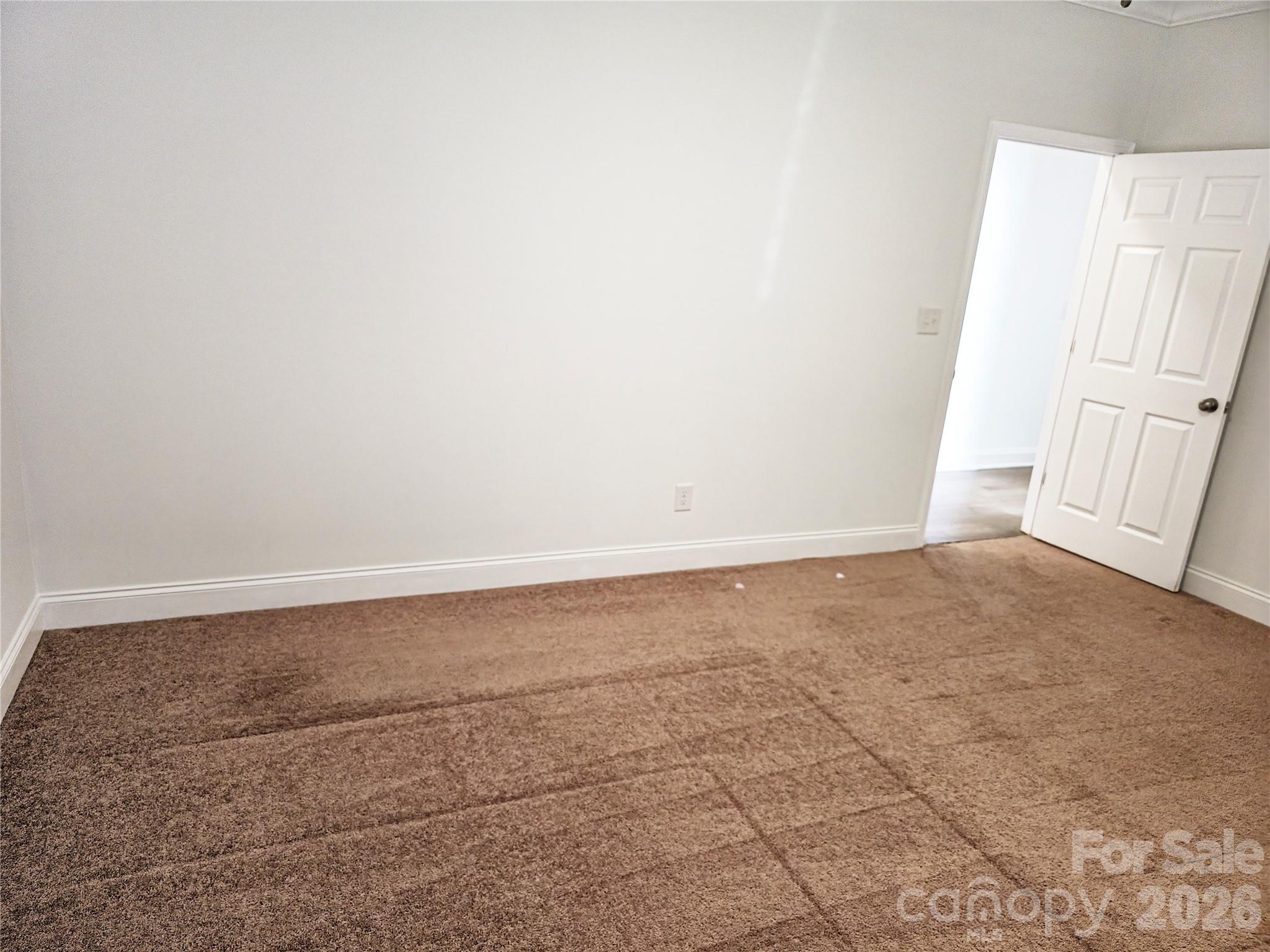 4607 Nesbit Road Monroe, NC 28112 - Photo 19 of 30 an empty room with wooden floor and window
