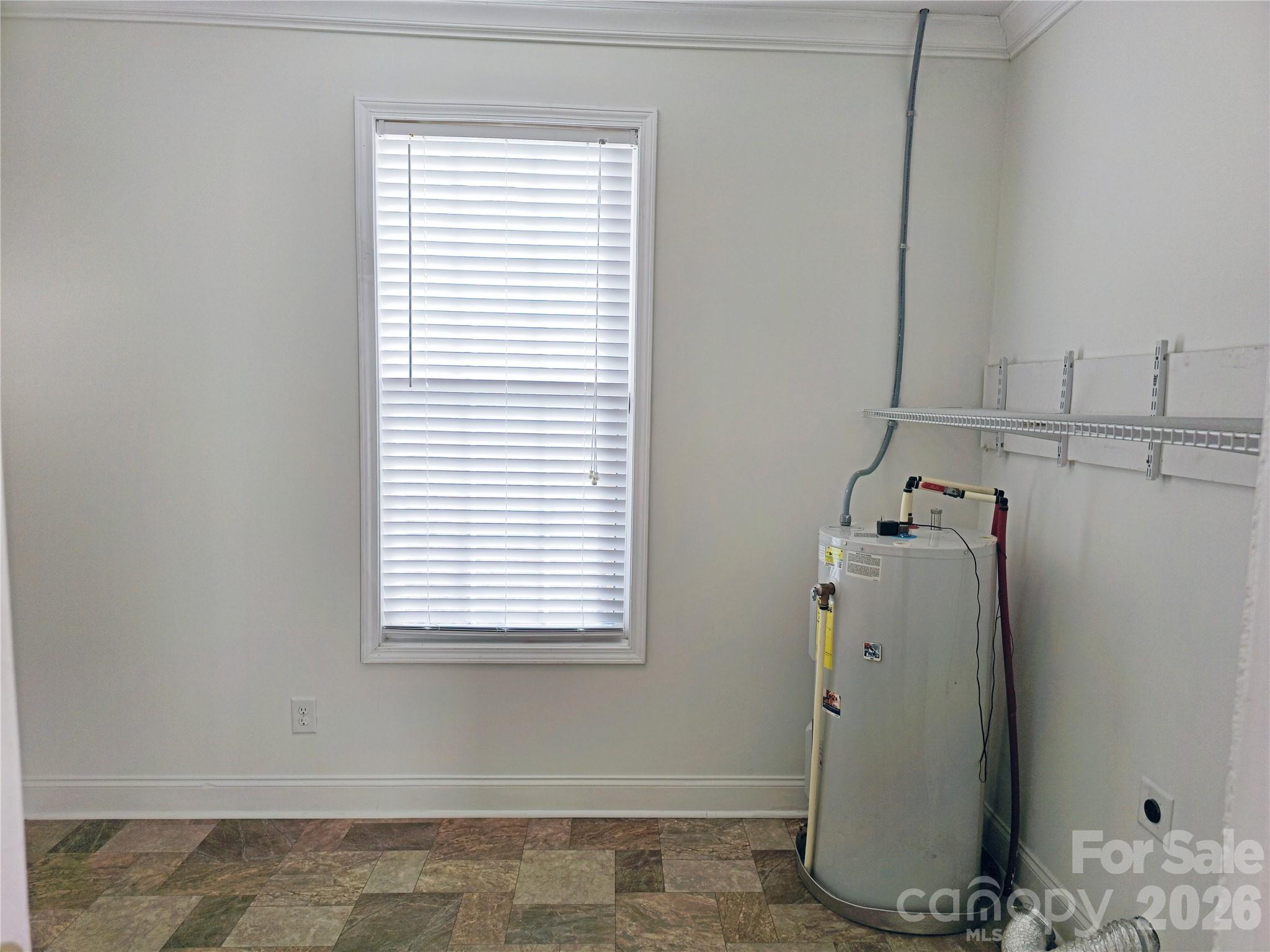 4607 Nesbit Road Monroe, NC 28112 - Photo 22 of 30 a view of storage and utility room with a window