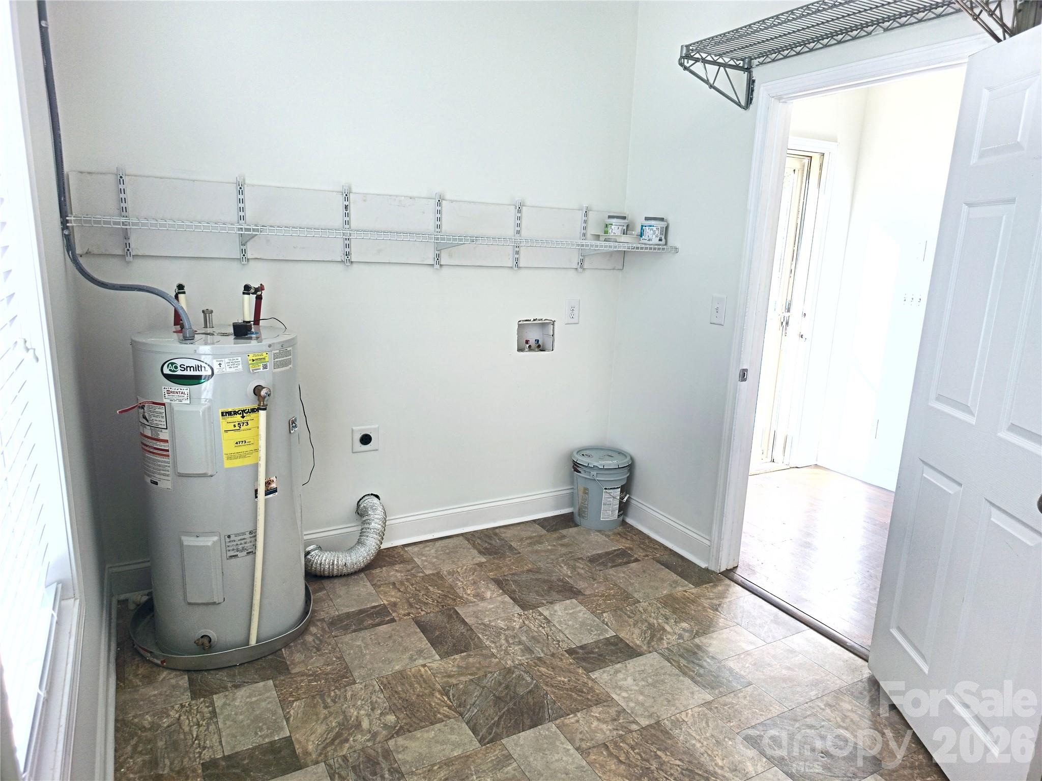 4607 Nesbit Road Monroe, NC 28112 - Photo 23 of 30 a view of storage and utility room with racks on the wall