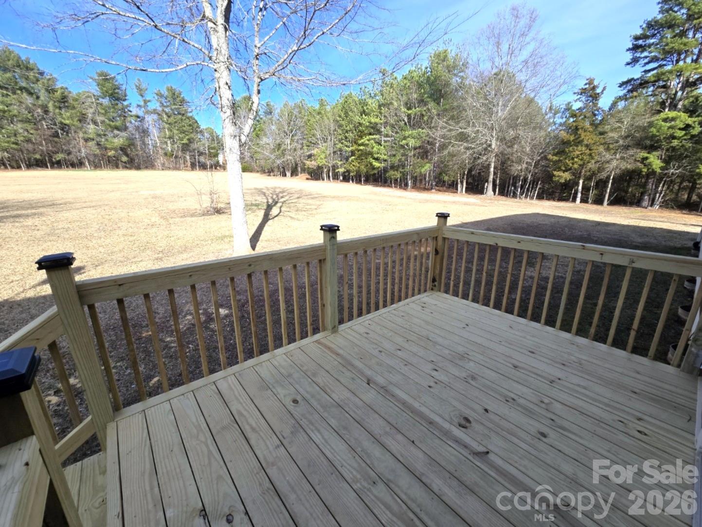 4607 Nesbit Road Monroe, NC 28112 - Photo 30 of 30 a view of deck with wooden floor and lake view
