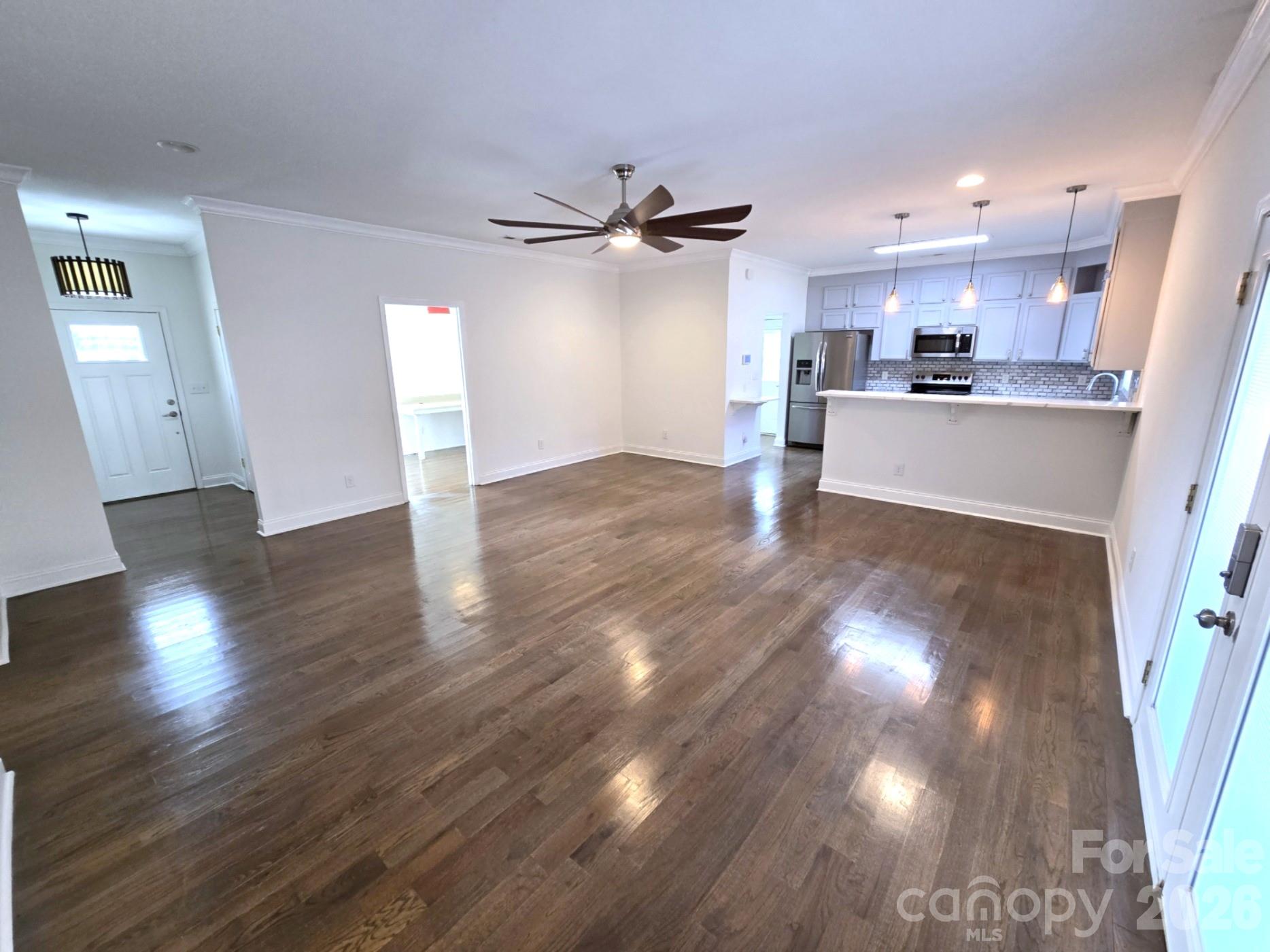 4607 Nesbit Road Monroe, NC 28112 - Photo 6 of 30 a view of a kitchen with wooden floor and a kitchen