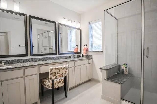 1402 French Violet Way Arlington, TX 76005 - Photo 12 of 29 a bathroom with a granite countertop sink and a mirror
