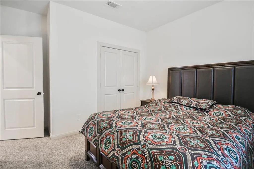 1402 French Violet Way Arlington, TX 76005 - Photo 13 of 29 a bedroom with a bed and a closet
