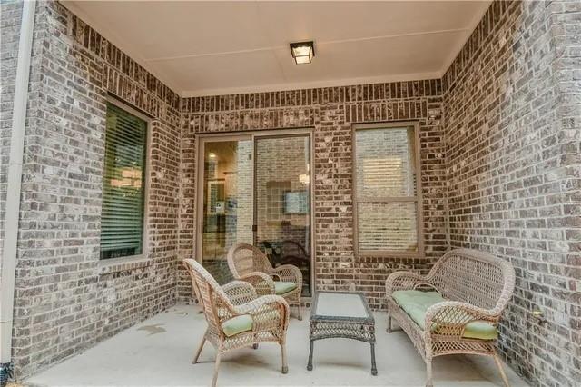 1402 French Violet Way Arlington, TX 76005 - Photo 17 of 29 a view of a chair and table in the patio