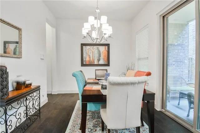 1402 French Violet Way Arlington, TX 76005 - Photo 22 of 29 a dining room with furniture a chandelier and wooden floor