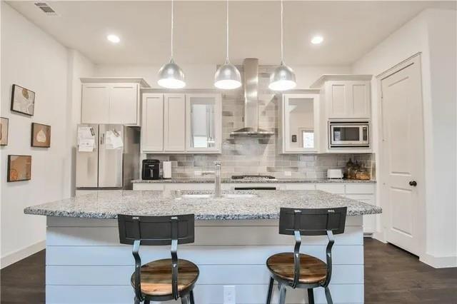 1402 French Violet Way Arlington, TX 76005 - Photo 4 of 29 a kitchen with stainless steel appliances granite countertop a sink a stove counter space and cabinets