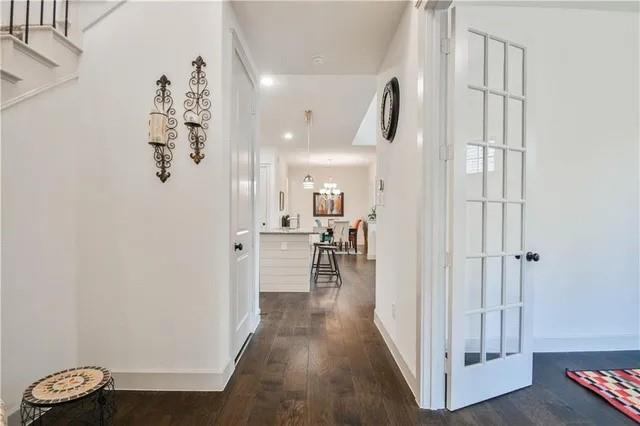 1402 French Violet Way Arlington, TX 76005 - Photo 7 of 29 a view of a hallway with wooden floor and windows