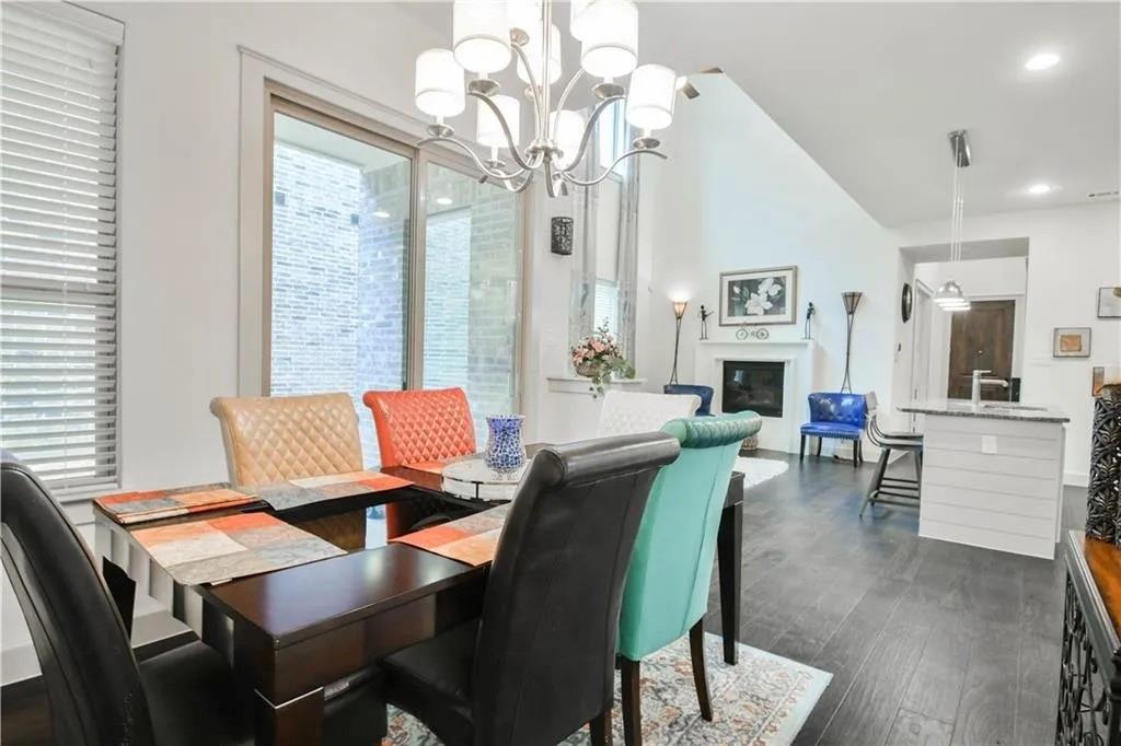 1402 French Violet Way Arlington, TX 76005 - Photo 9 of 29 a view of a dining room with furniture and a chandelier