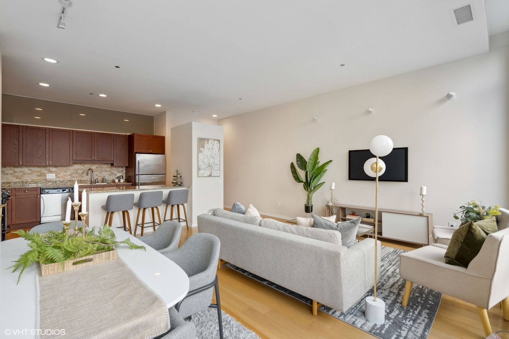 65 East Monroe Street, Unit 4217 Chicago, IL 60603 - Photo 12 of 27 a living room with furniture and kitchen view