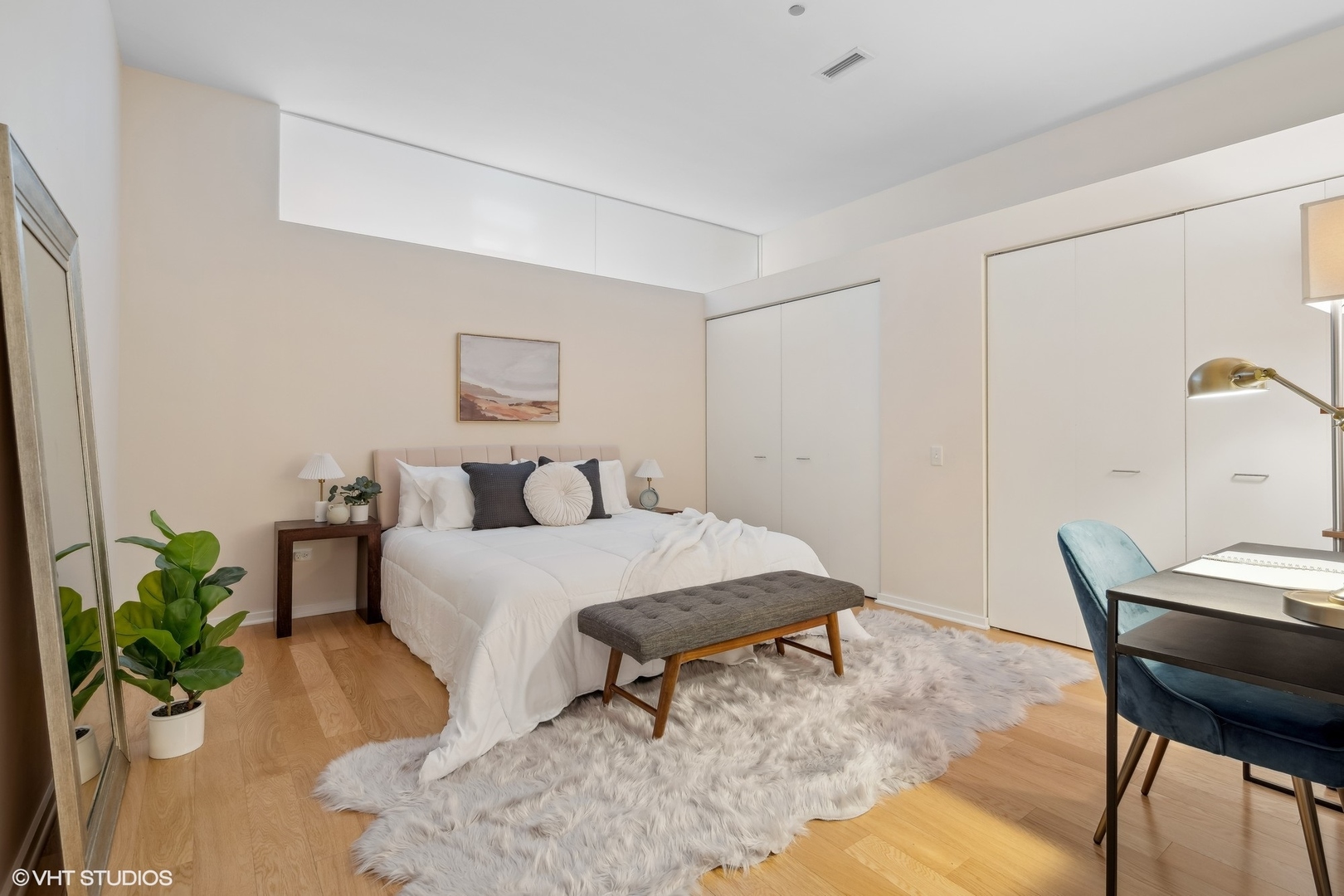 65 East Monroe Street, Unit 4217 Chicago, IL 60603 - Photo 13 of 27 a bed room with a bed and a table