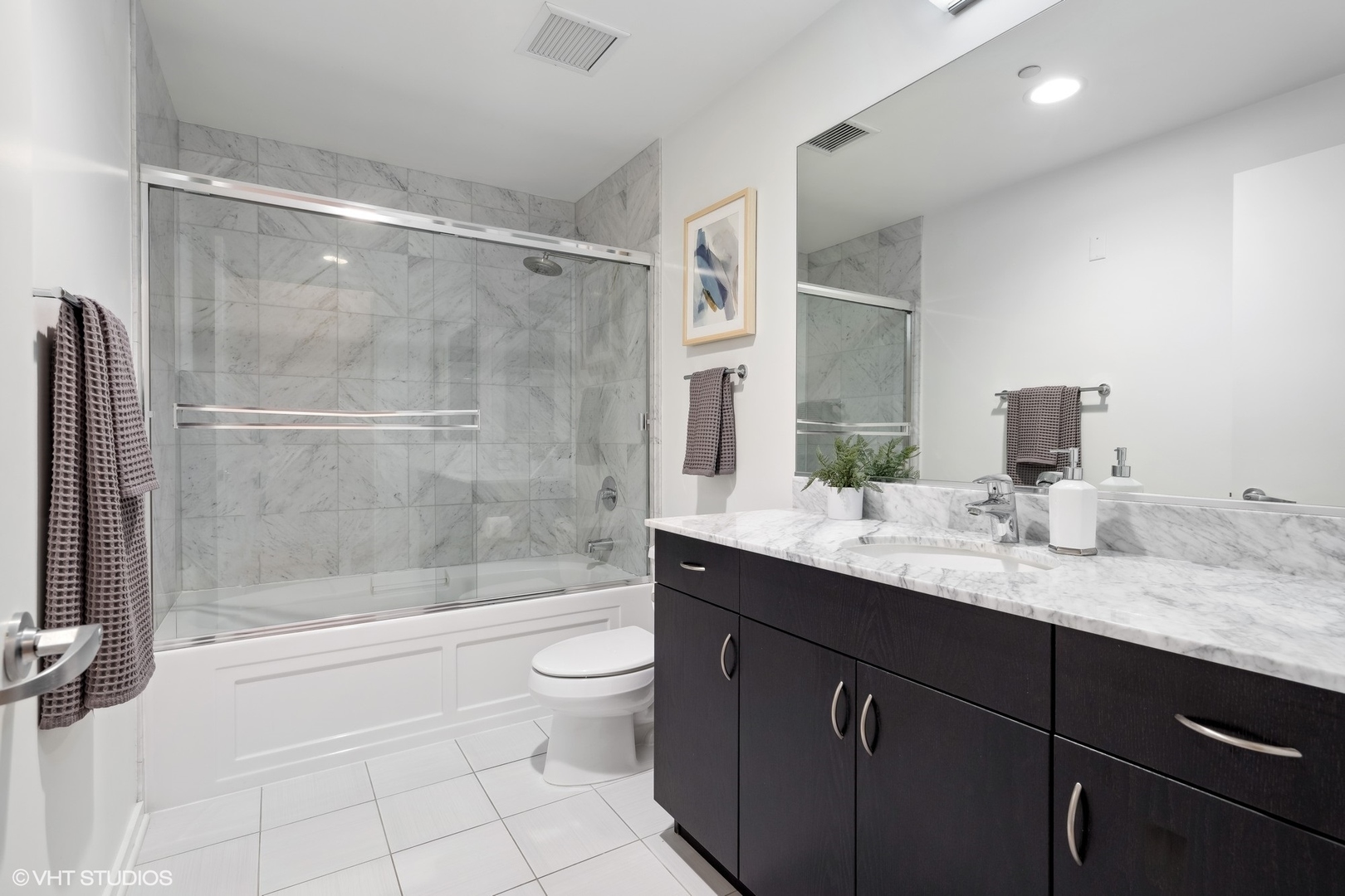 65 East Monroe Street, Unit 4217 Chicago, IL 60603 - Photo 15 of 27 a bathroom with a granite countertop sink a toilet and shower