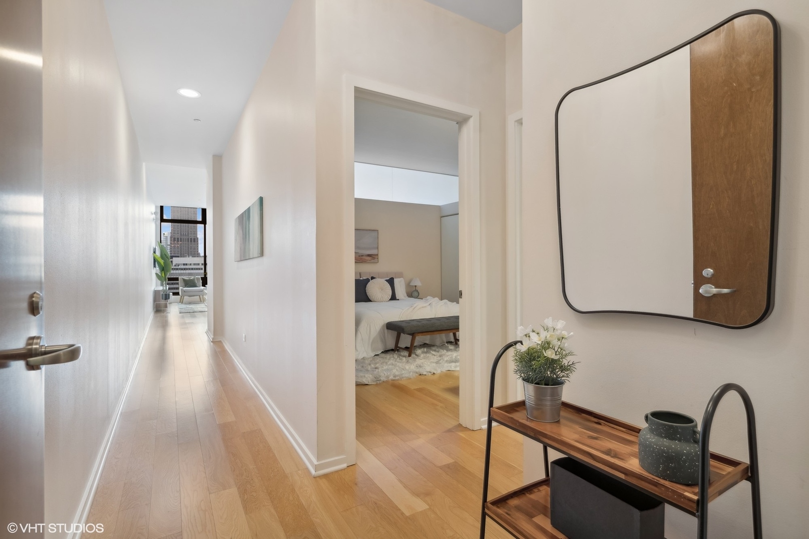 65 East Monroe Street, Unit 4217 Chicago, IL 60603 - Photo 16 of 27 a view of a hallway with wooden floor and furniture