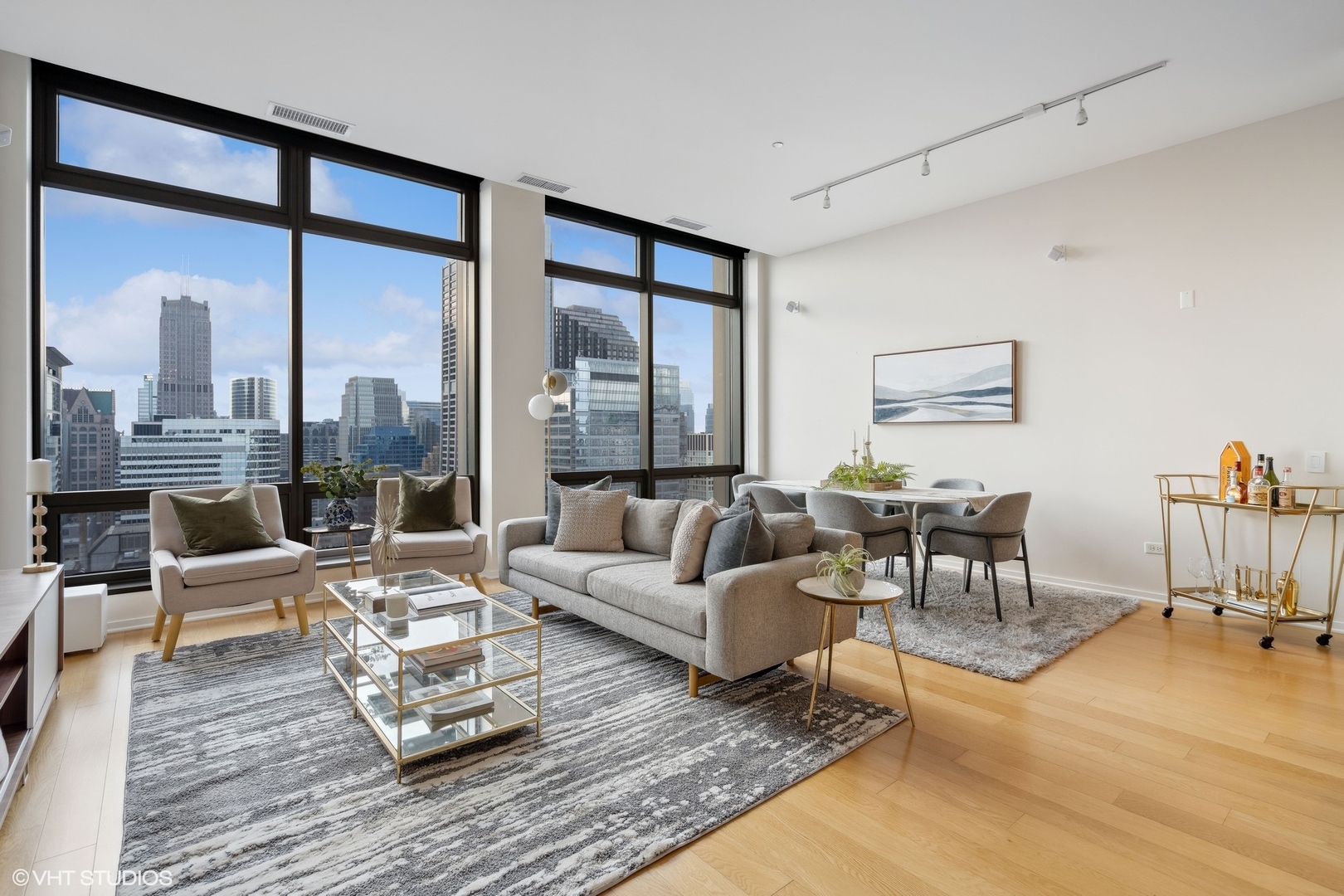 65 East Monroe Street, Unit 4217 Chicago, IL 60603 - Photo 4 of 27 a living room with furniture and a large window