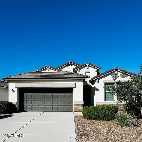 a front view of a house with a garage