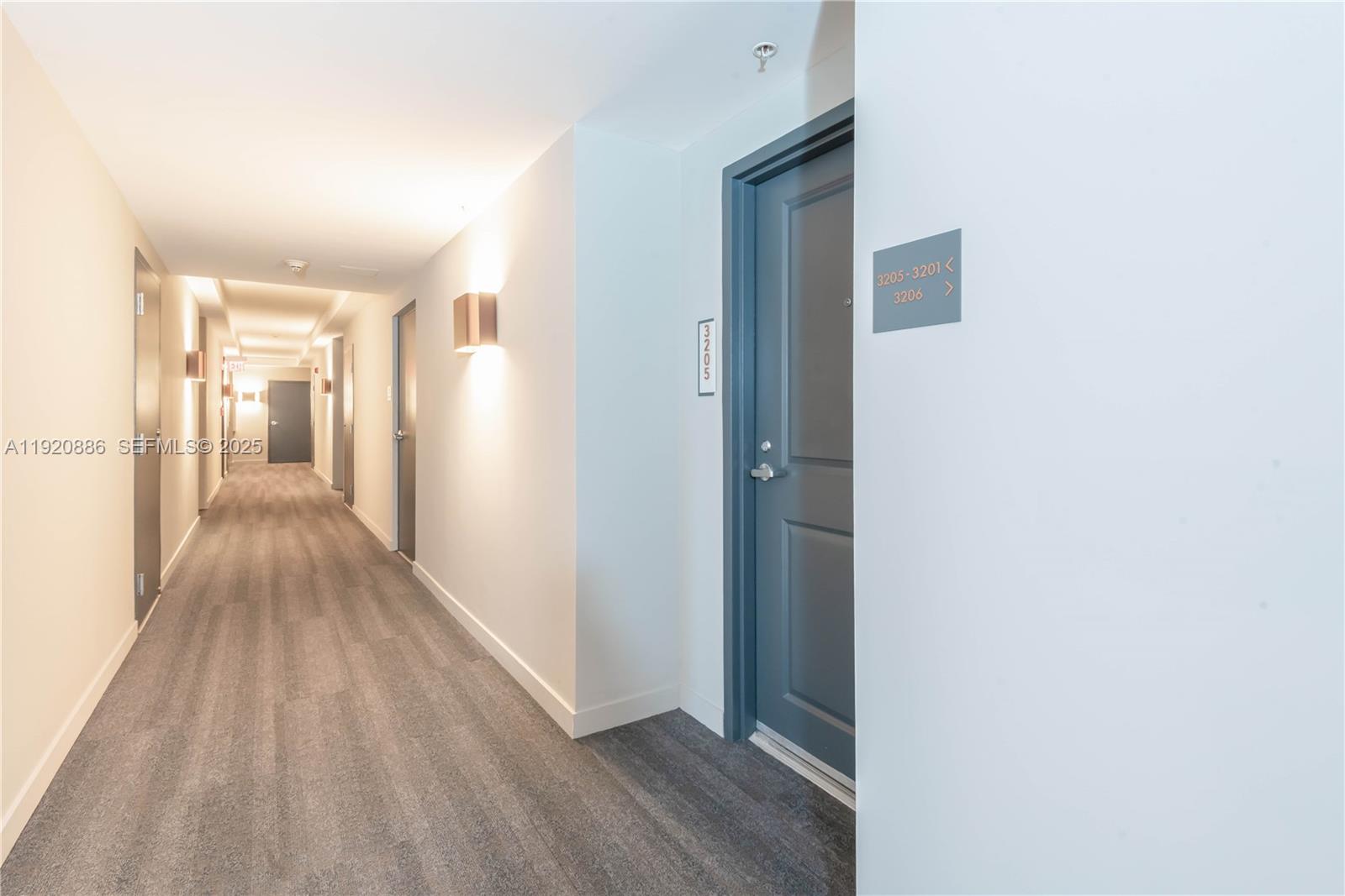 1250 South Miami Avenue, Unit 3205 Miami, FL 33130 - Photo 22 of 36 a view of a hallway with wooden floor