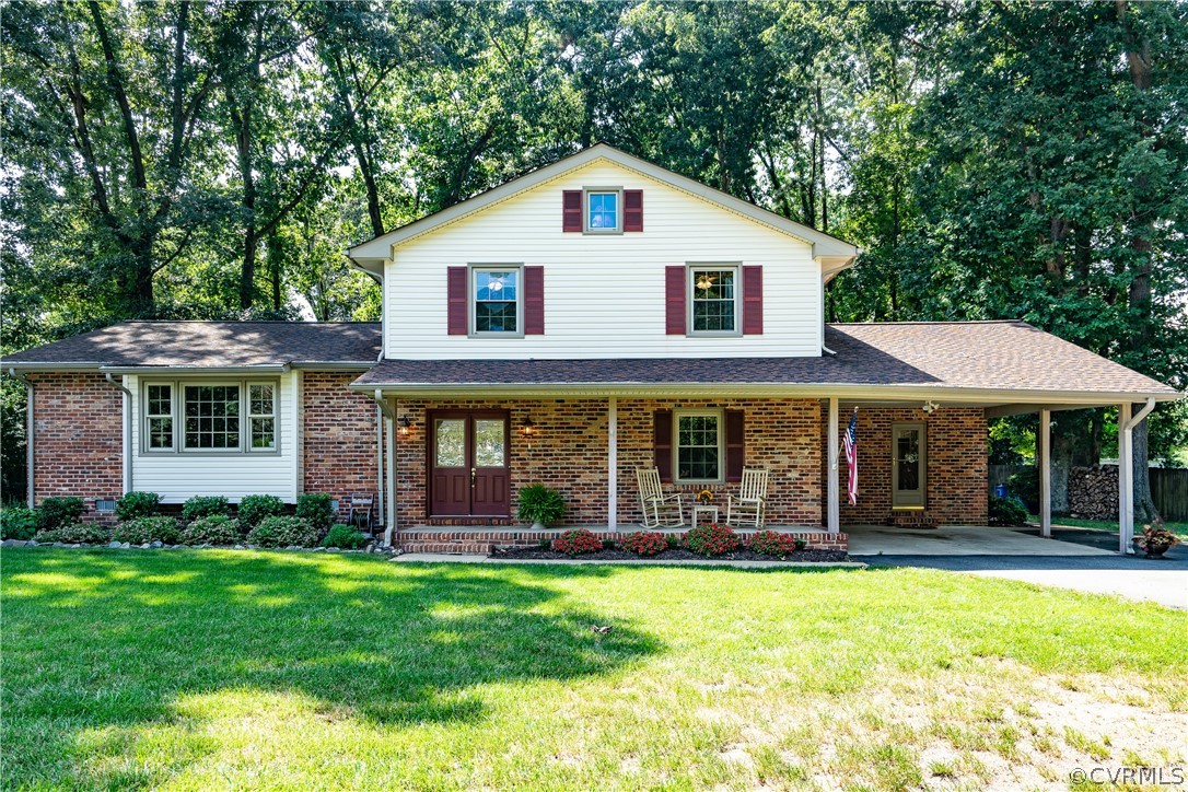11410 Driscoll Road Chester, VA 23831 - Photo 1 of 24 a front view of a house with a yard
