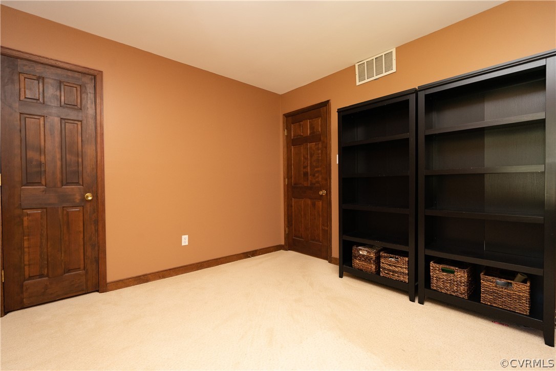 11410 Driscoll Road Chester, VA 23831 - Photo 14 of 24 a view of an empty room with window and cabinet