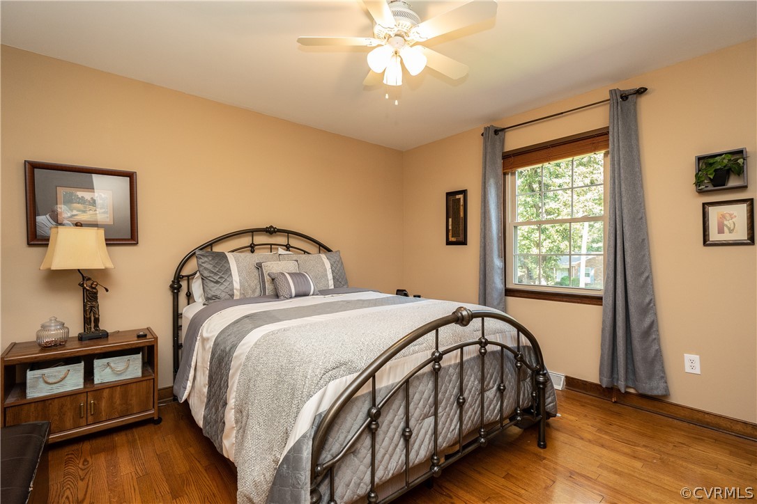 11410 Driscoll Road Chester, VA 23831 - Photo 18 of 24 a bedroom with a bed and a window