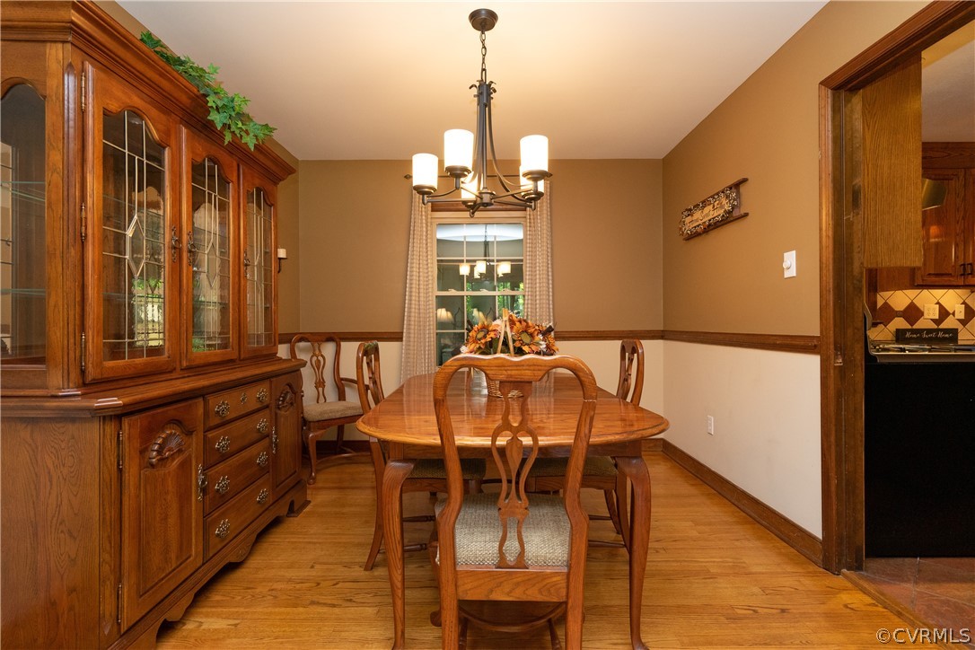 11410 Driscoll Road Chester, VA 23831 - Photo 5 of 24 a view of a dining room with furniture window and wooden floor