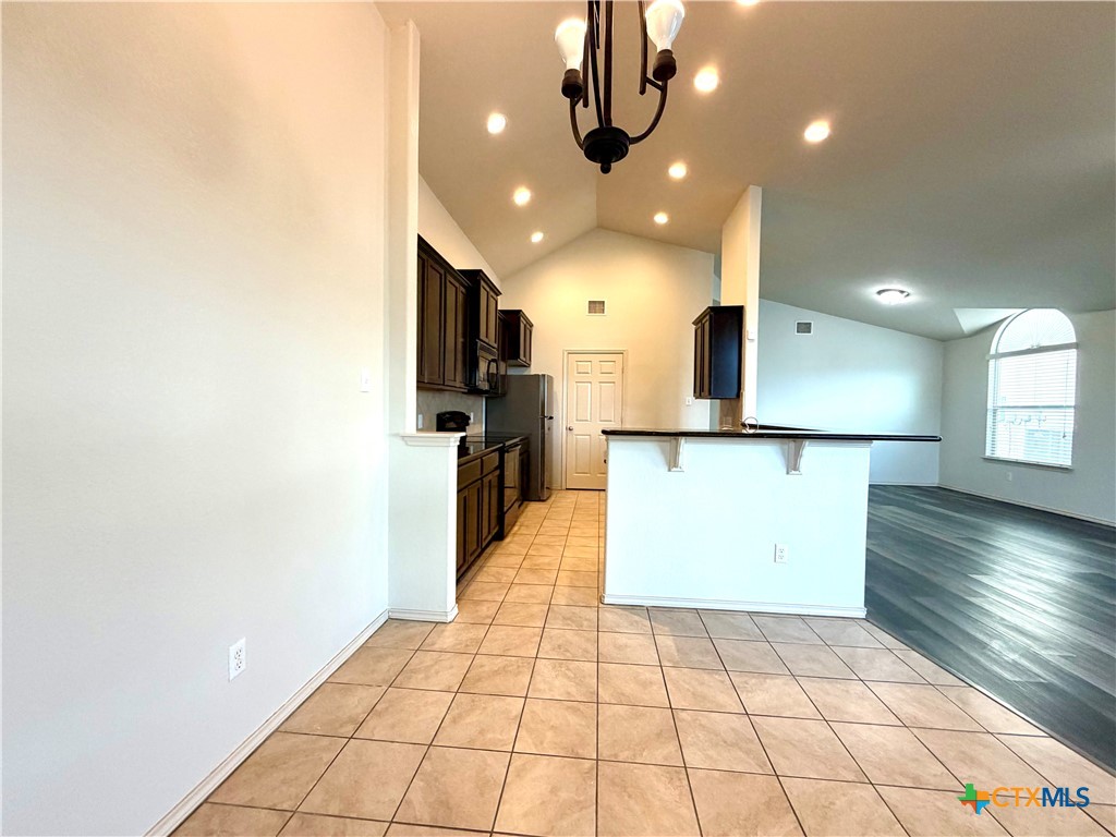 500 Obsidian Lane Jarrell, TX 76537 - Photo 17 of 33 a view of a kitchen with a sink and a microwave