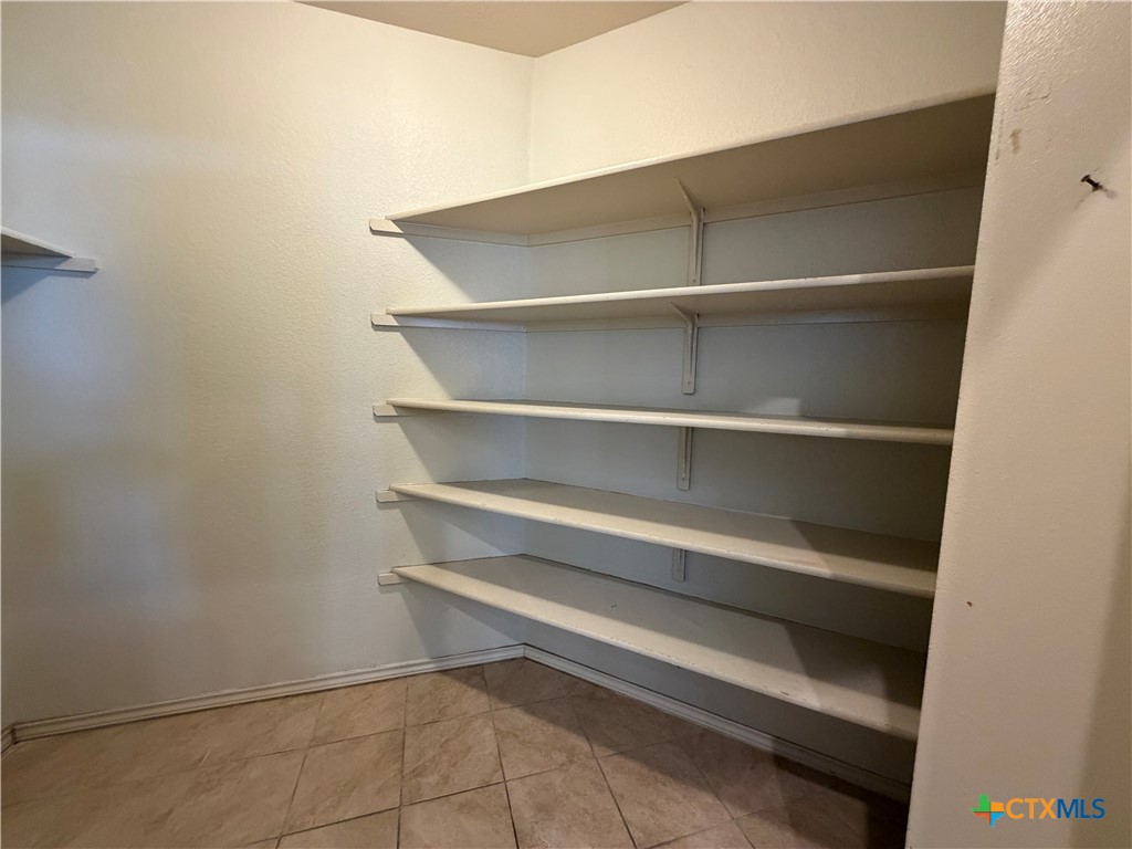 500 Obsidian Lane Jarrell, TX 76537 - Photo 18 of 33 a view of room with rack on the wall