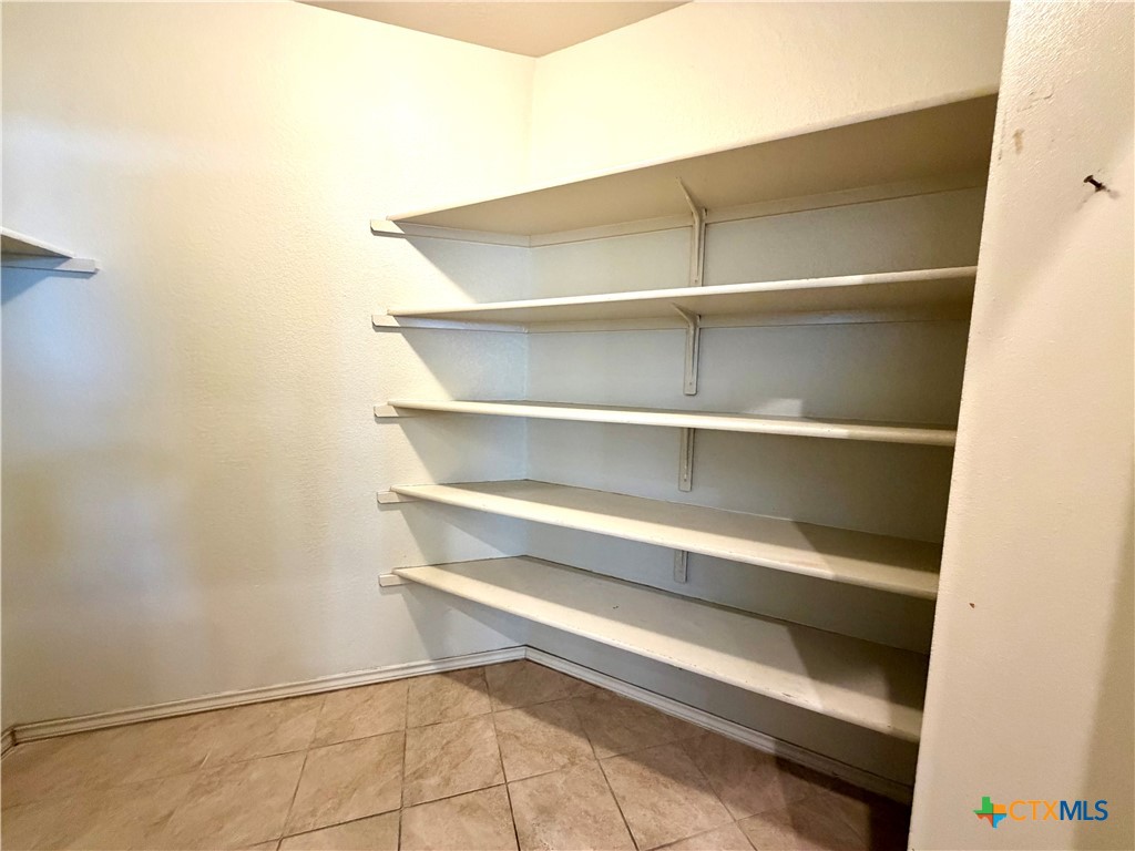 500 Obsidian Lane Jarrell, TX 76537 - Photo 19 of 33 a view of room with rack on the wall
