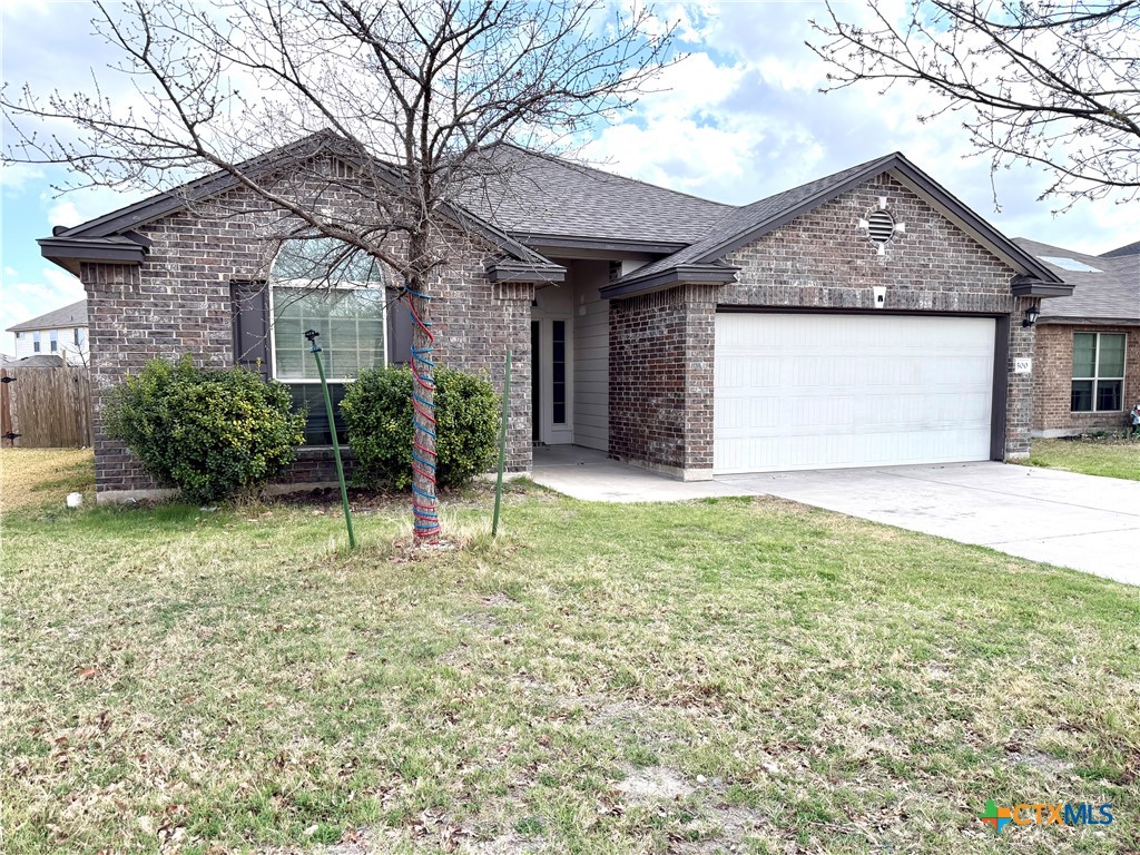 500 Obsidian Lane Jarrell, TX 76537 - Photo 2 of 33 a house with trees in front of it