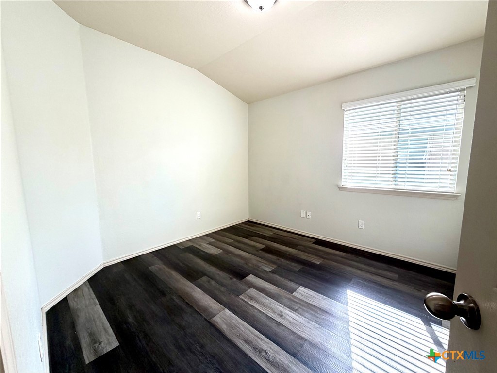 500 Obsidian Lane Jarrell, TX 76537 - Photo 26 of 33 a view of a room with wooden floor and a window