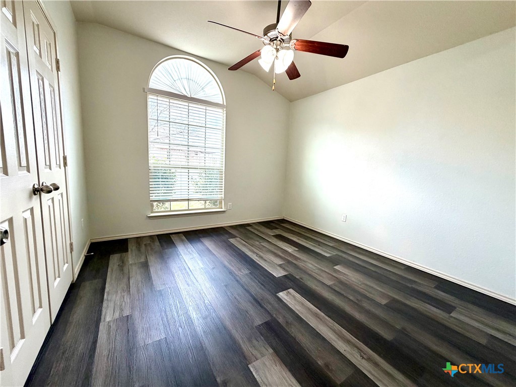 500 Obsidian Lane Jarrell, TX 76537 - Photo 28 of 33 wooden floor in an empty room with a window