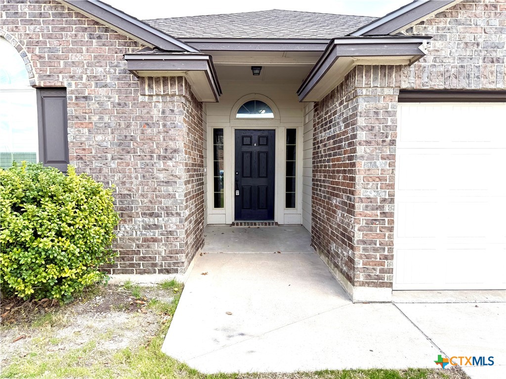 500 Obsidian Lane Jarrell, TX 76537 - Photo 3 of 33 a view of front door of house with an window