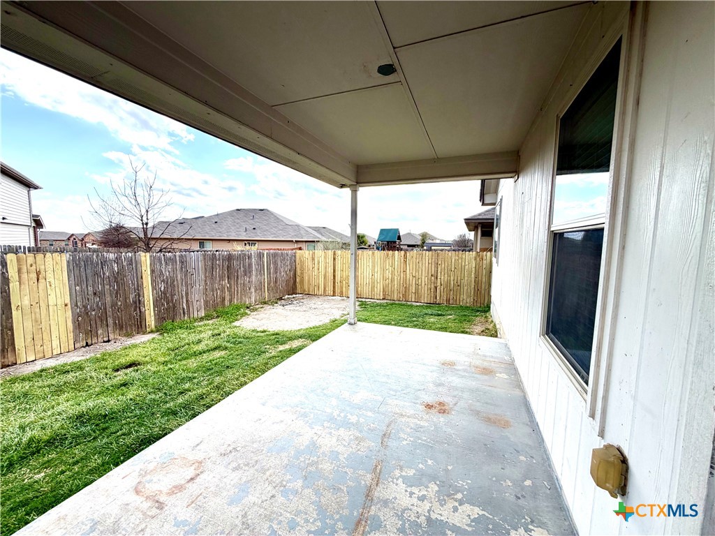500 Obsidian Lane Jarrell, TX 76537 - Photo 32 of 33 a view of a backyard with wooden fence
