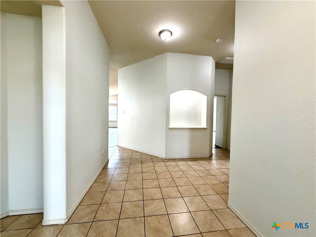 500 Obsidian Lane Jarrell, TX 76537 - Photo 5 of 33 a view of a hallway with wooden floor