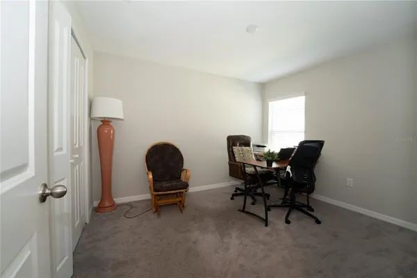 a workspace with furniture and a window