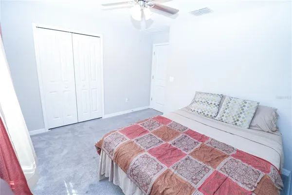 a view of a room with a table and chairs