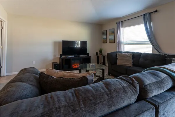 a work room with furniture and a window