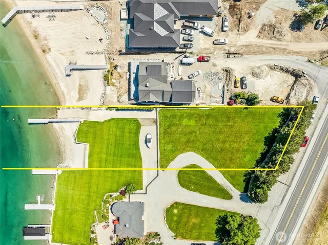 a view of a swimming pool with a patio and a garden